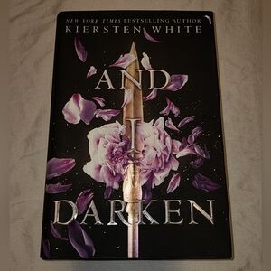 And I Darken Hardcover Book